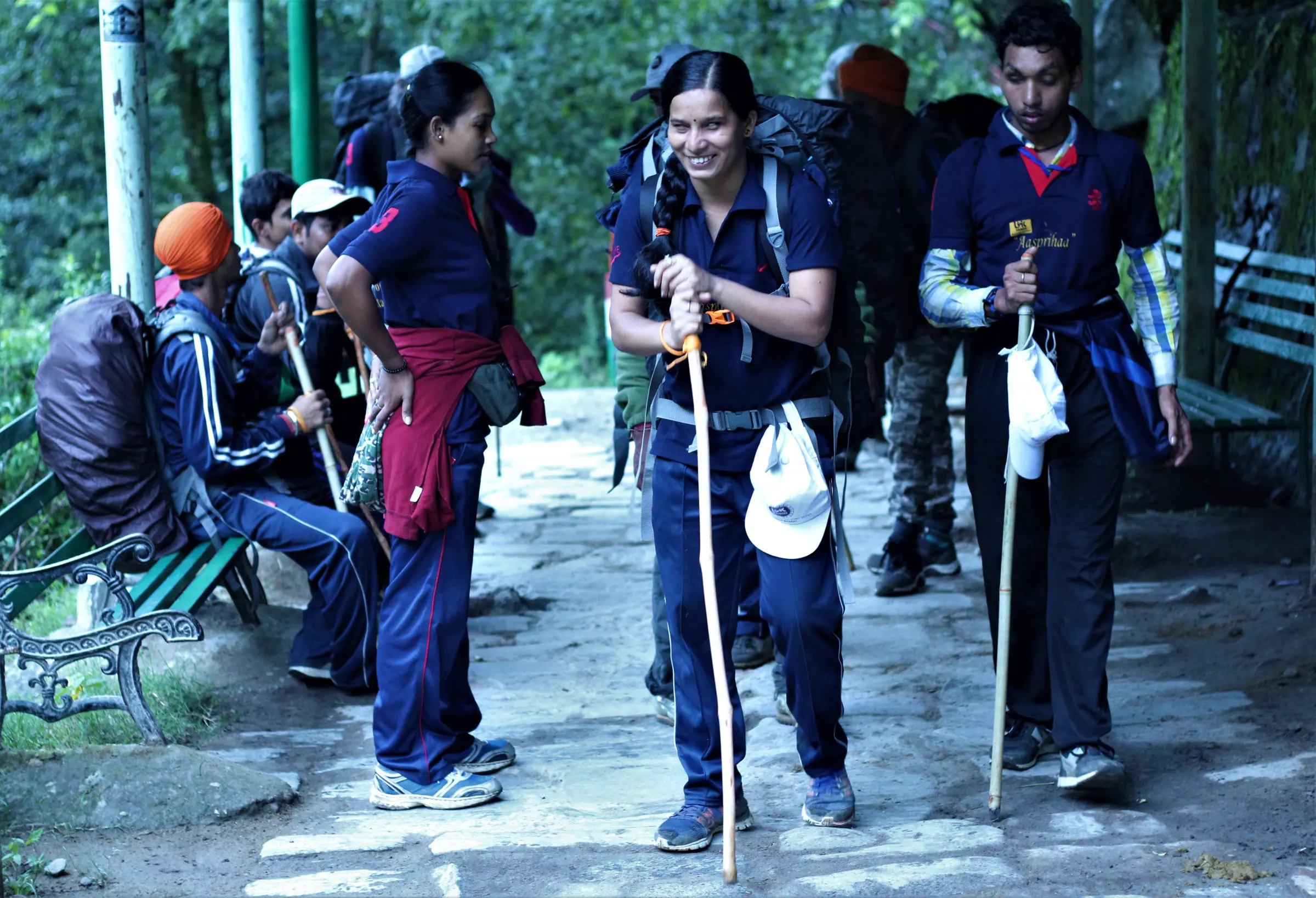 A group of trekkers with walking sticks on the Govindghat–Ghangaria trail, Chamoli