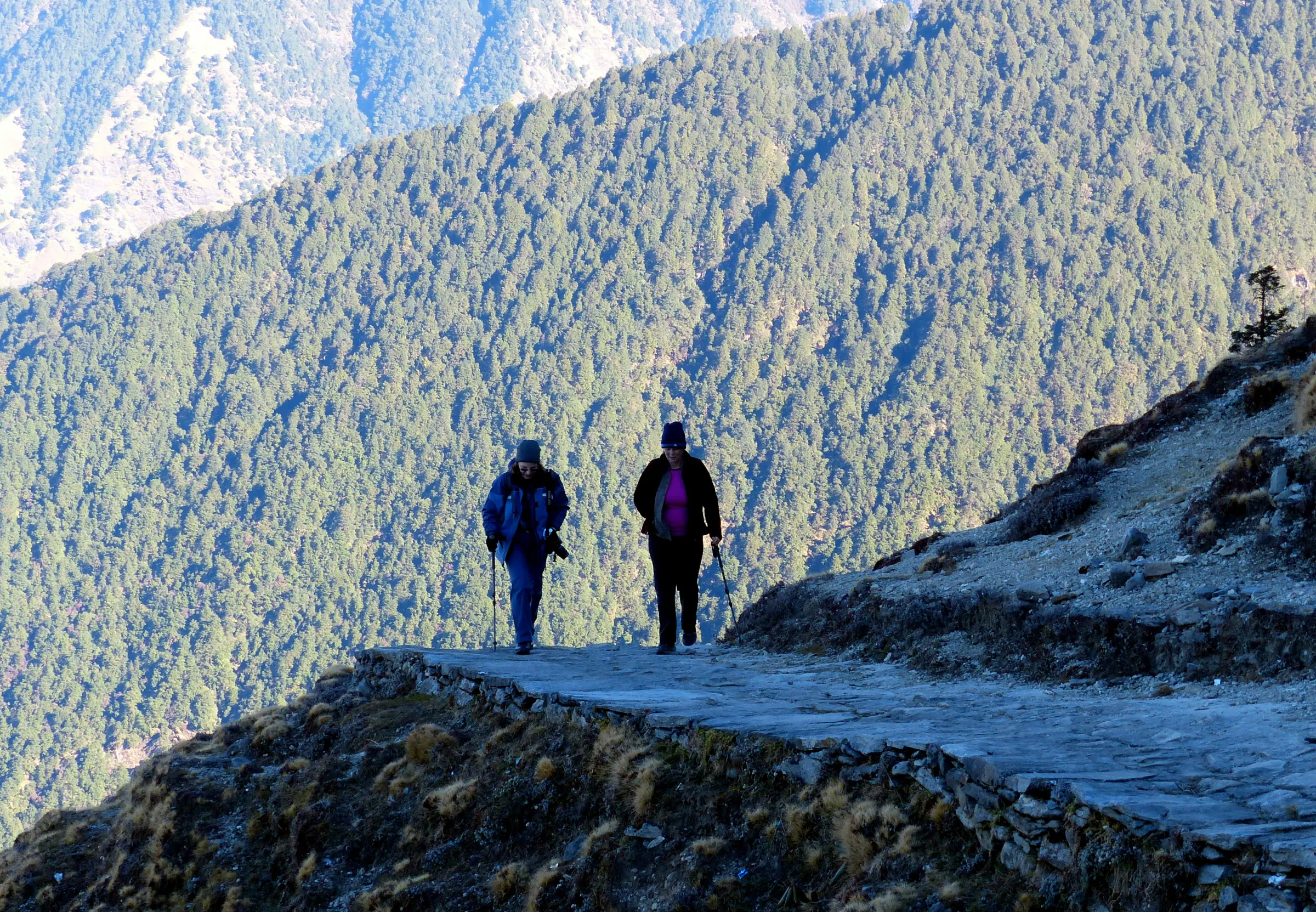 Two trekkers walking the ridge trail towards Tungnath, one of the Panch Kedar